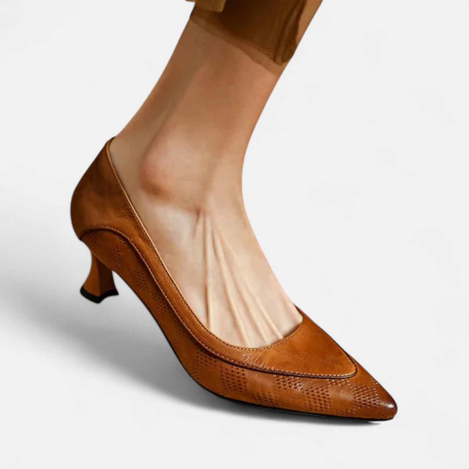 Brown leather heels from THE WHITMORE FAMILY's Amara collection, featuring a sleek design and pointed toe.