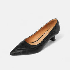 Brown leather heels from THE WHITMORE FAMILY's Amara collection, featuring a sleek design and pointed toe style.