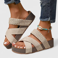 Brown Danyzelle™ orthopedic sandals by THE WHITMORE FAMILY with supportive straps and cushioned soles for comfort.