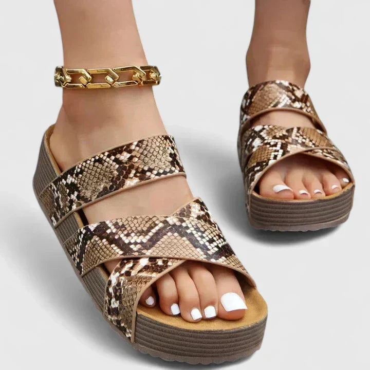 Brown Danyzelle™ orthopedic sandals by THE WHITMORE FAMILY, featuring supportive straps and cushioned soles for comfort.