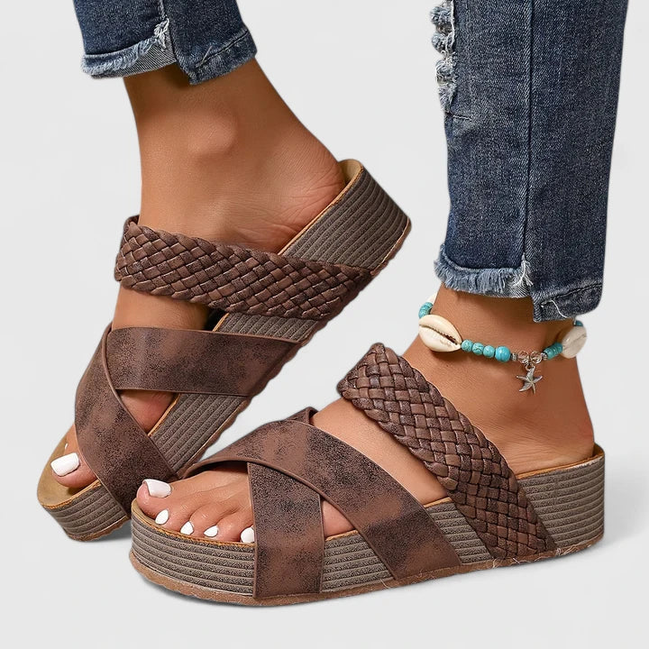 Brown Danyzelle™ orthopedic sandals by THE WHITMORE FAMILY with cushioned soles and adjustable straps for comfortable support.