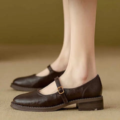 Brown Grace Classic Comfort Mary Janes by THE WHITMORE FAMILY, featuring supportive design and polished leather finish.