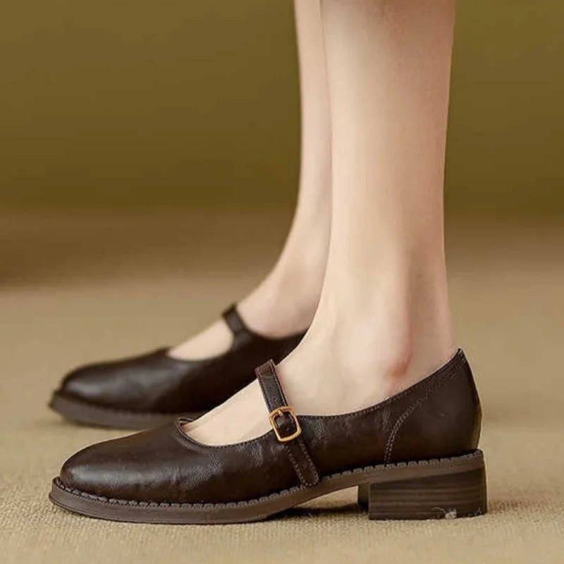 Brown Grace Classic Comfort Mary Janes by THE WHITMORE FAMILY, featuring supportive design and polished leather finish.