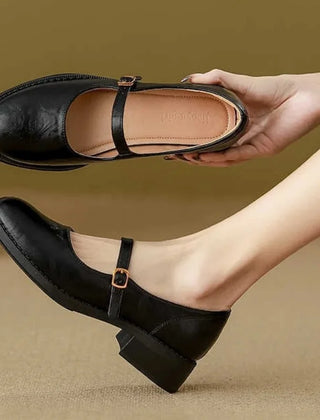 Brown Grace Classic Comfort Mary Janes by THE WHITMORE FAMILY featuring a polished leather finish and comfortable slip-on design.