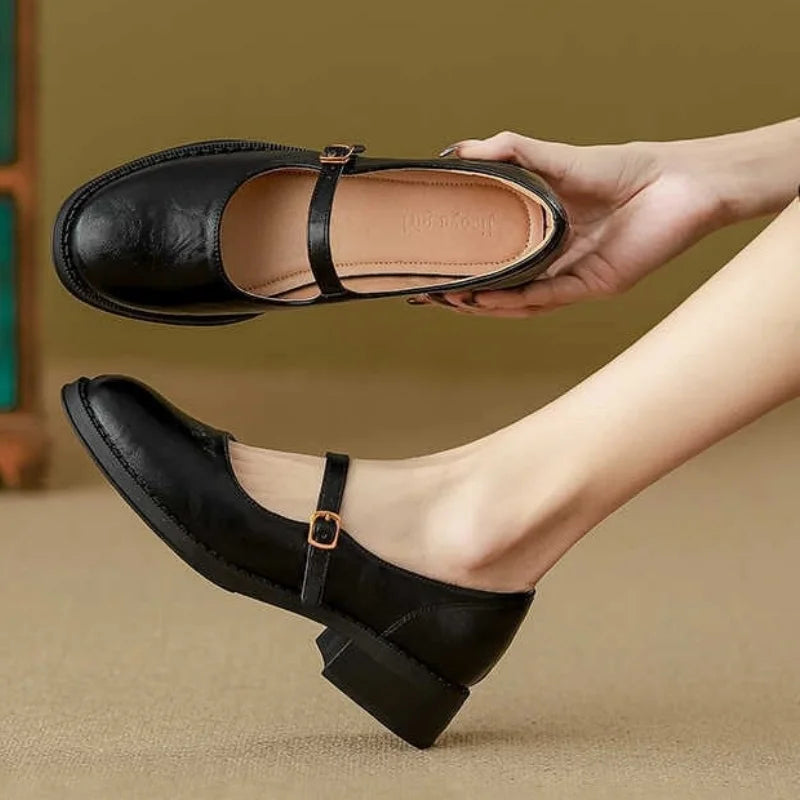 Brown Grace Classic Comfort Mary Janes by THE WHITMORE FAMILY featuring a polished leather finish and comfortable slip-on design.