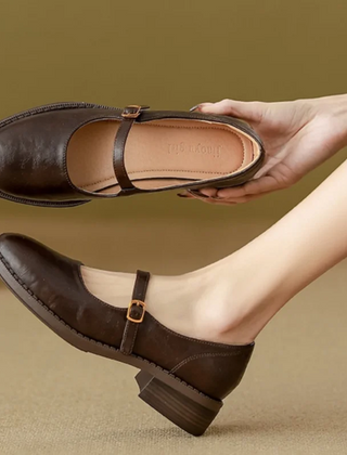Brown Grace Classic Comfort Mary Janes by THE WHITMORE FAMILY, featuring a supportive leather design and timeless style.