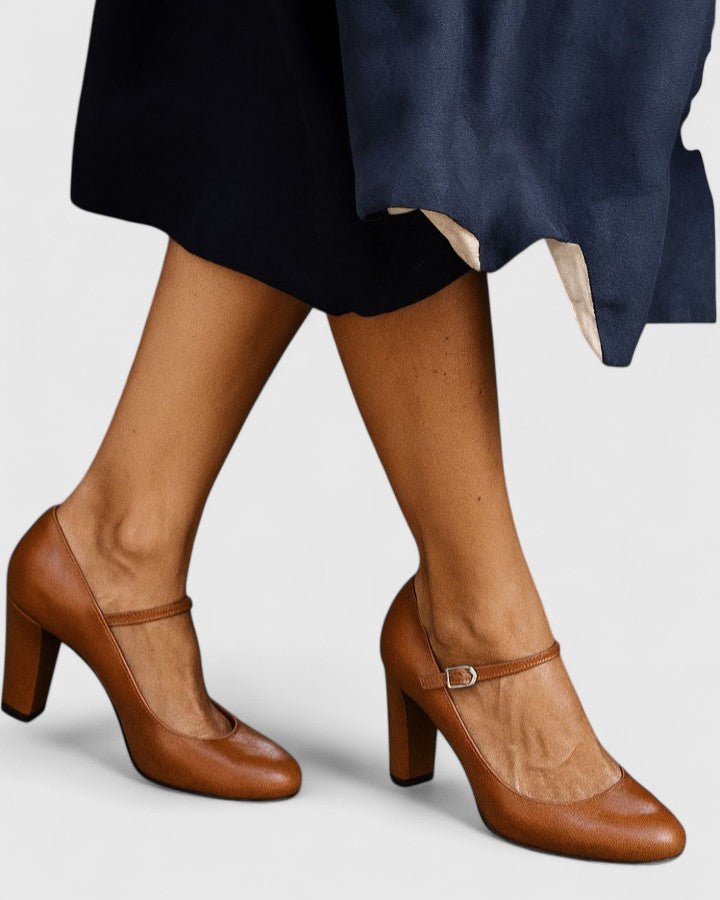 Brown Jamyrah sophisticated heels by THE WHITMORE FAMILY displayed on a neutral background.