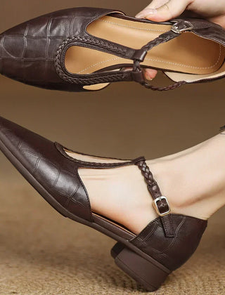 Brown leather Lily Mary Janes by THE WHITMORE FAMILY, featuring classic design and comfortable straps for young children.