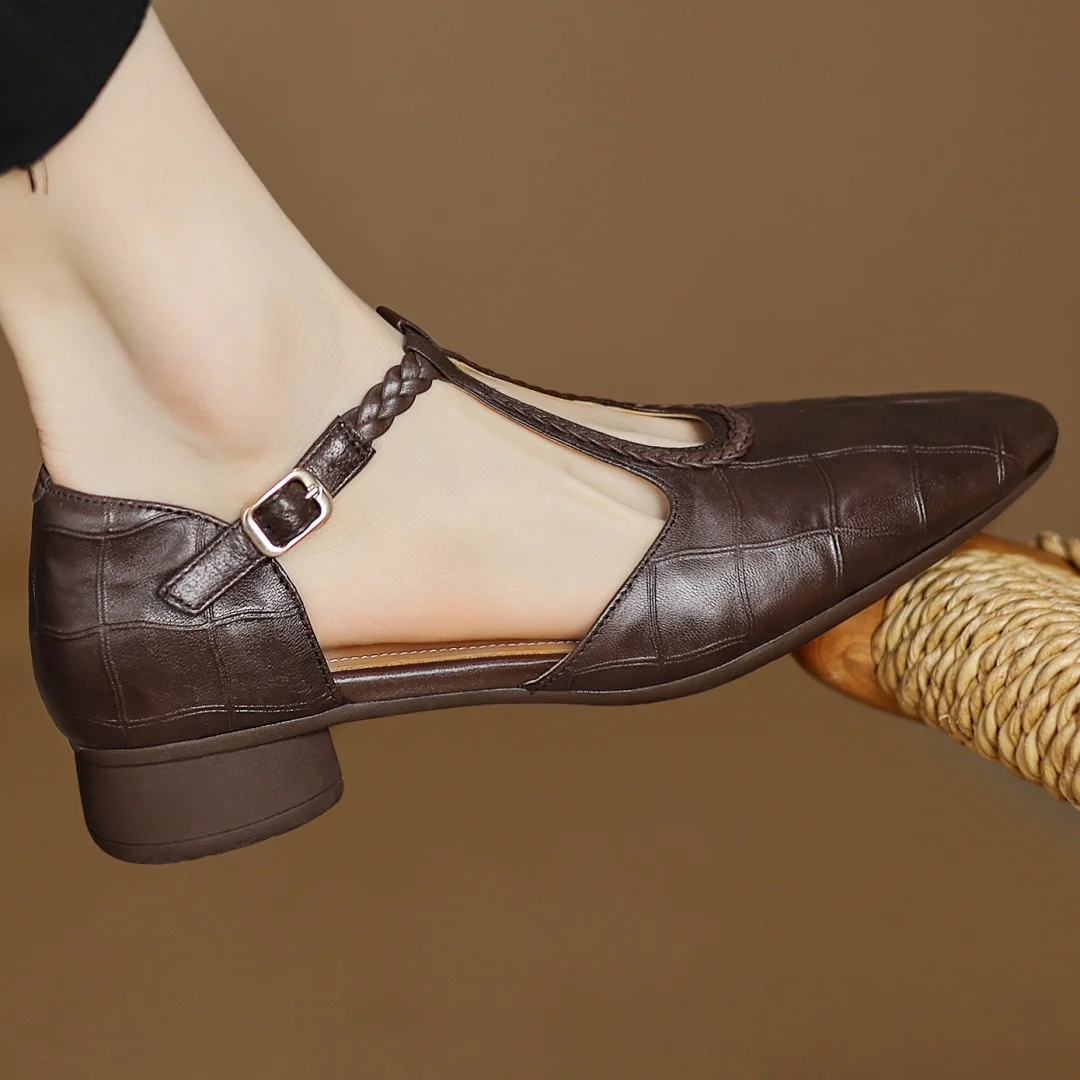 Brown leather Lily Mary Janes by THE WHITMORE FAMILY featuring classic strap design and rounded toe for children.
