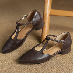 Brown leather Lily Mary Janes by THE WHITMORE FAMILY, featuring classic design and durable craftsmanship for children.