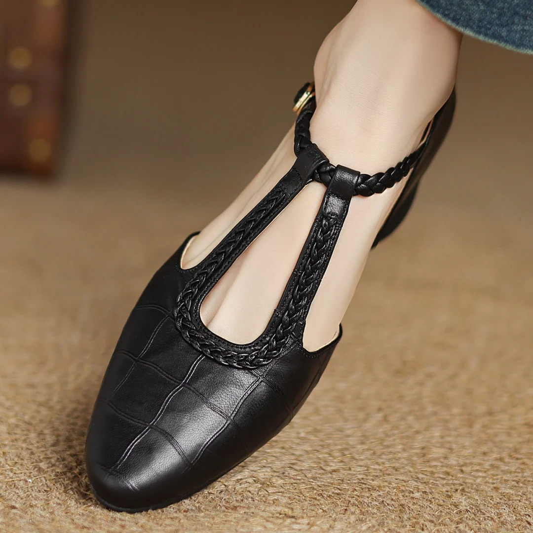 Brown leather Lily Mary Janes by THE WHITMORE FAMILY featuring classic design and rounded toe for children's footwear.