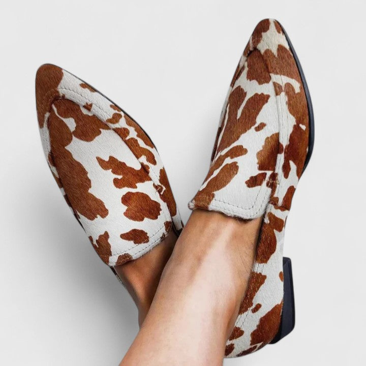 Brown Reniah comfortable loafers from THE WHITMORE FAMILY featuring a sleek slip-on design and cushioned interior.