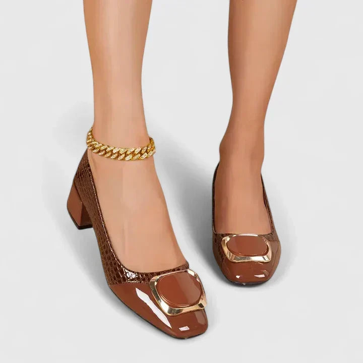 Brown Olyzabeth comfortable loafers by THE WHITMORE FAMILY, featuring a classic slip-on design and cushioned interior.