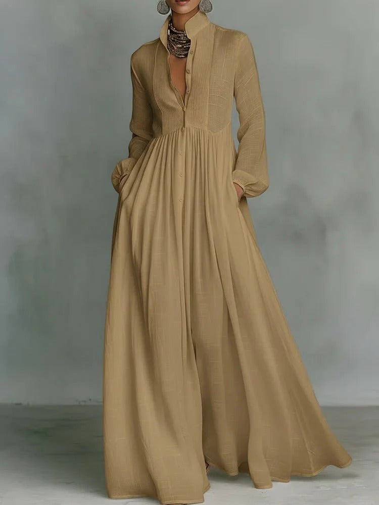 Brown Grace flowing button-front maxi dress by THE WHITMORE FAMILY, featuring a relaxed fit and elegant design.