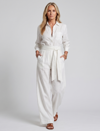 Brown Jovie long sleeve button-front wide-leg jumpsuit by THE WHITMORE FAMILY, featuring a stylish and comfortable fit.