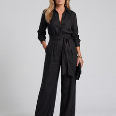 Brown Jovie long sleeve button-front wide-leg jumpsuit by THE WHITMORE FAMILY, shown on a model.