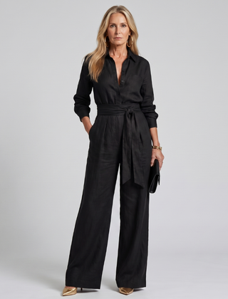 Brown Jovie long sleeve button-front wide-leg jumpsuit by THE WHITMORE FAMILY, shown on a model.