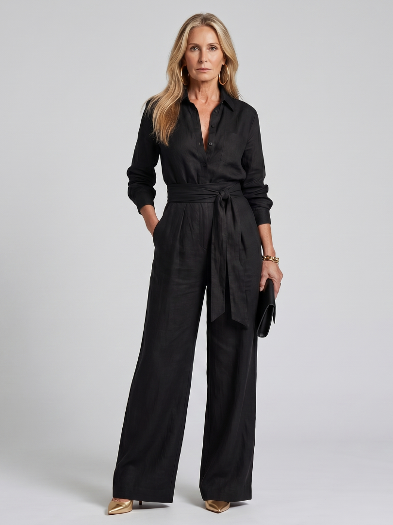 Brown Jovie long sleeve button-front wide-leg jumpsuit by THE WHITMORE FAMILY, shown on a model.