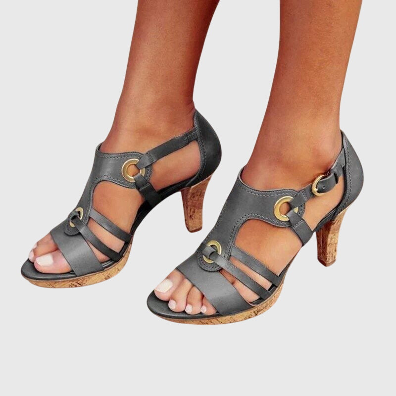 Brown Carla orthopaedic heels by THE WHITMORE FAMILY, showcasing stylish supportive footwear with a rounded toe and block heel.