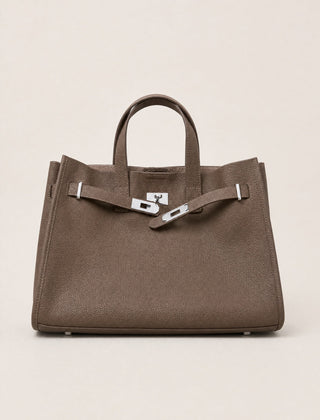 Coffee brown leather tote bag by THE WHITMORE FAMILY featuring sturdy handles and spacious interior for everyday use.