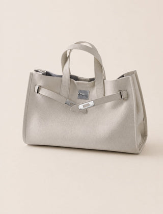 Cream leather tote bag with structured handles and spacious interior, designed by THE WHITMORE FAMILY.