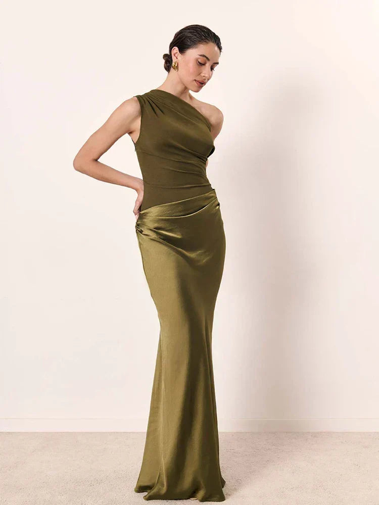 Ashley maxi dress by THE WHITMORE FAMILY in brown satin with a guilt detail, shown in a close-up of the elegant fabric and design.