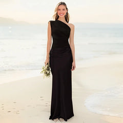 Ashley maxi dress in brown satin with a guilt detail from THE WHITMORE FAMILY, featuring a fitted bodice and flowing skirt.