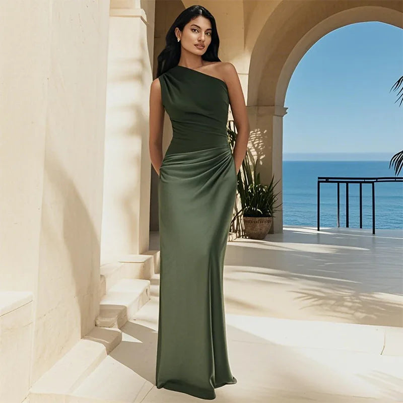 Ashley maxi dress by THE WHITMORE FAMILY in brown satin with a guilt detail, shown on a model.