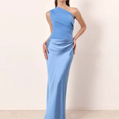 Ashley maxi dress by THE WHITMORE FAMILY in brown satin with a guilt detail, shown on a model.