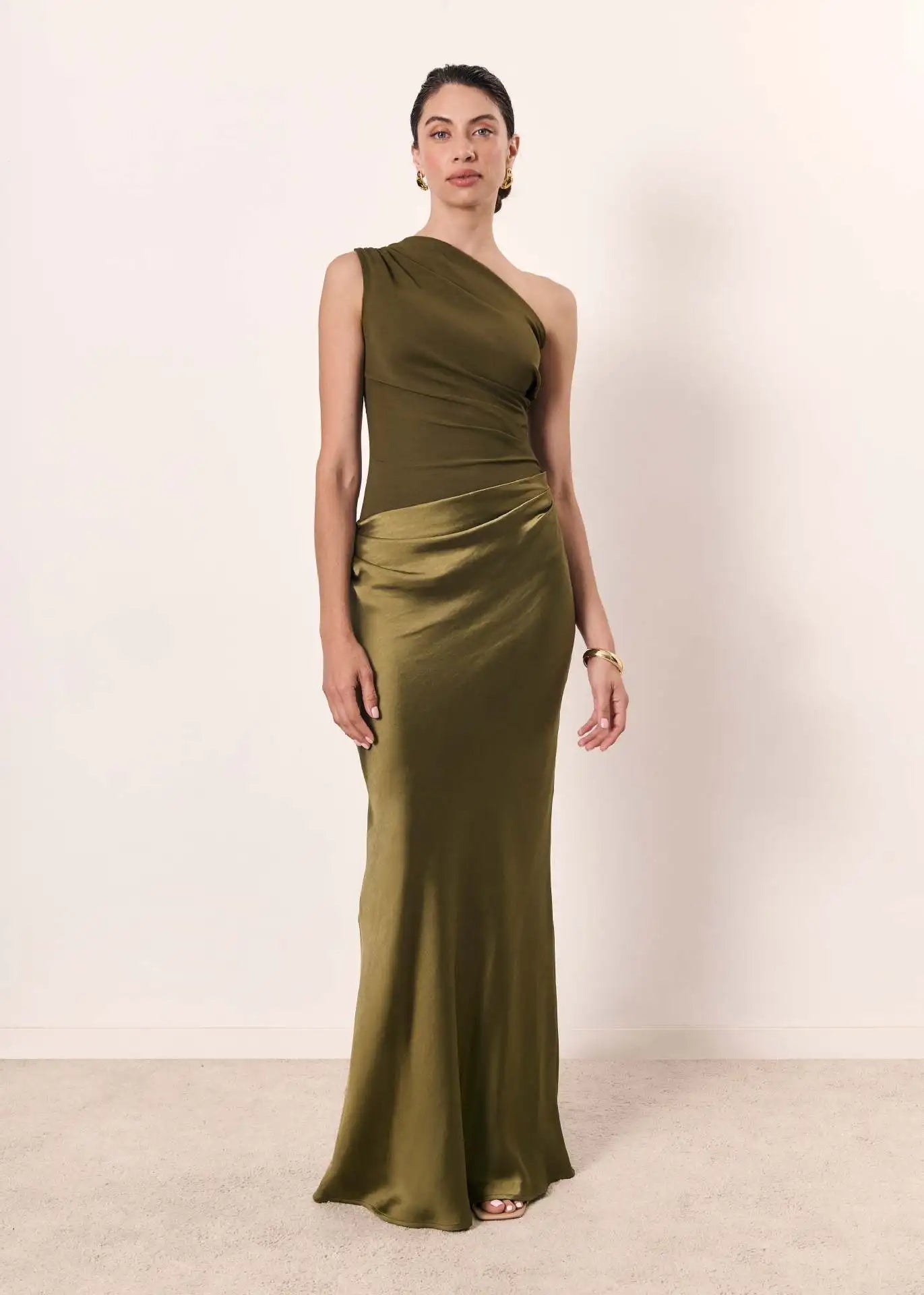 Ashley maxi dress by THE WHITMORE FAMILY, brown satin fabric with a guilt detail, shown on a model.