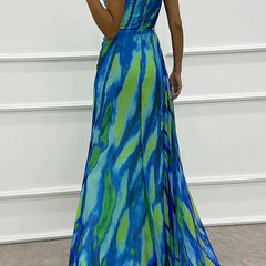 Blue Sandra Vibrant Draped Dress for wedding guest attire by THE WHITMORE FAMILY, shown on a model.