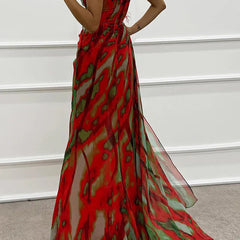 Blue Sandra vibrant draped dress by THE WHITMORE FAMILY, elegant for wedding guest attire, shown on a model.