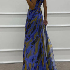 Blue Sandra vibrant draped dress by THE WHITMORE FAMILY, elegant attire for wedding guest occasions.