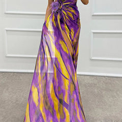 Blue vibrant draped dress by THE WHITMORE FAMILY, worn by a bridal guest in an elegant, flowing style for special occasions.