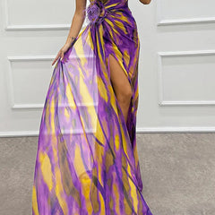 Blue Sandra vibrant draped dress for wedding guest from THE WHITMORE FAMILY, shown on a model in a formal setting