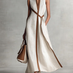 Burgundy Ashley sleeveless maxi dress by THE WHITMORE FAMILY, flowing fabric, fitted bodice, and ankle-length design.