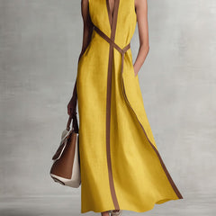 Burgundy Ashley sleeveless maxi dress by THE WHITMORE FAMILY, flowing fabric with a fitted bodice and ankle-length skirt.