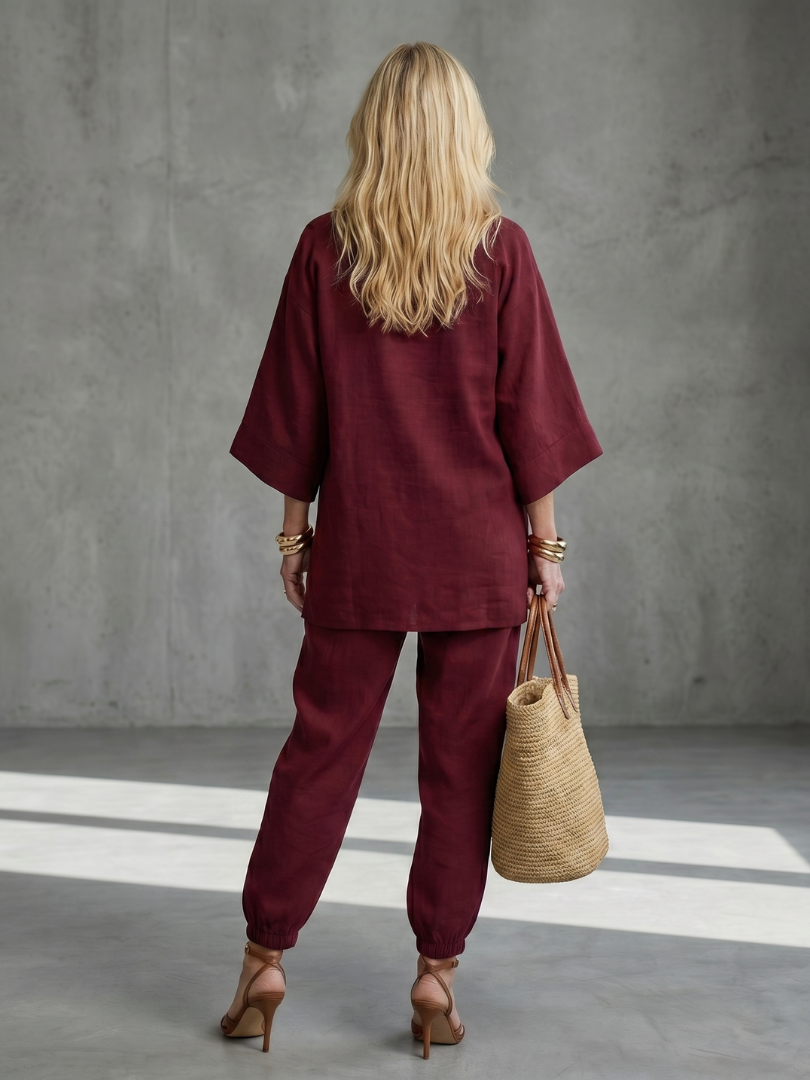 Burgundy Georgiana V-neck tunic and gathered trouser set by THE WHITMORE FAMILY, featuring a stylish, coordinated outfit.