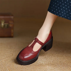 Red Barbara Chunky Pumps Mary Janes by THE WHITMORE FAMILY, featuring stylish design and sturdy heel, shown from a side view.