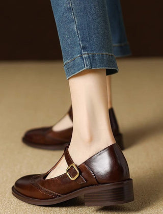Beige Suzy Mary Janes by THE WHITMORE FAMILY, stylish slip-on shoes with rounded toes and decorative straps.
