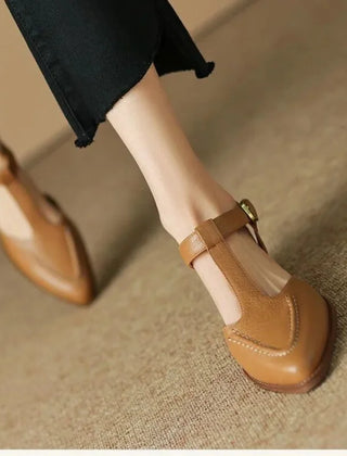 Light brown Madeleine classic buckle shoes by THE WHITMORE FAMILY, featuring a sleek design and secure buckle closure.