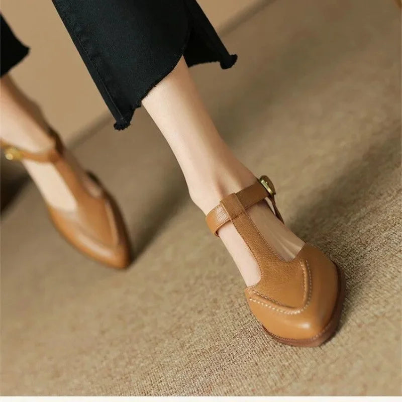 Light brown Madeleine classic buckle shoes by THE WHITMORE FAMILY, featuring a sleek design and secure buckle closure.