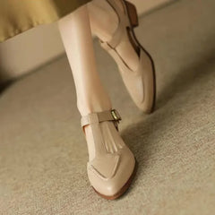 Light brown Madeleine Classic Buckle Shoes by THE WHITMORE FAMILY, featuring a stylish buckle and comfortable design.