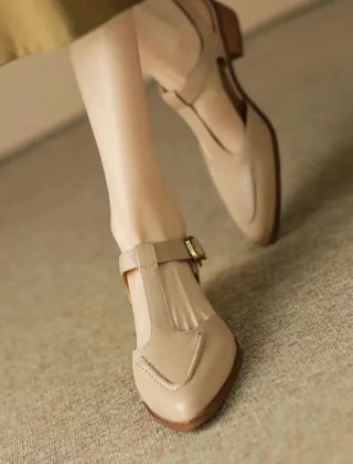 Light brown Madeleine Classic Buckle Shoes by THE WHITMORE FAMILY, featuring a stylish buckle and comfortable design.