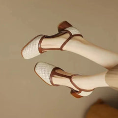 Off-white Isava mid heel leather shoes by THE WHITMORE FAMILY, featuring a stylish design and comfortable mid heel.