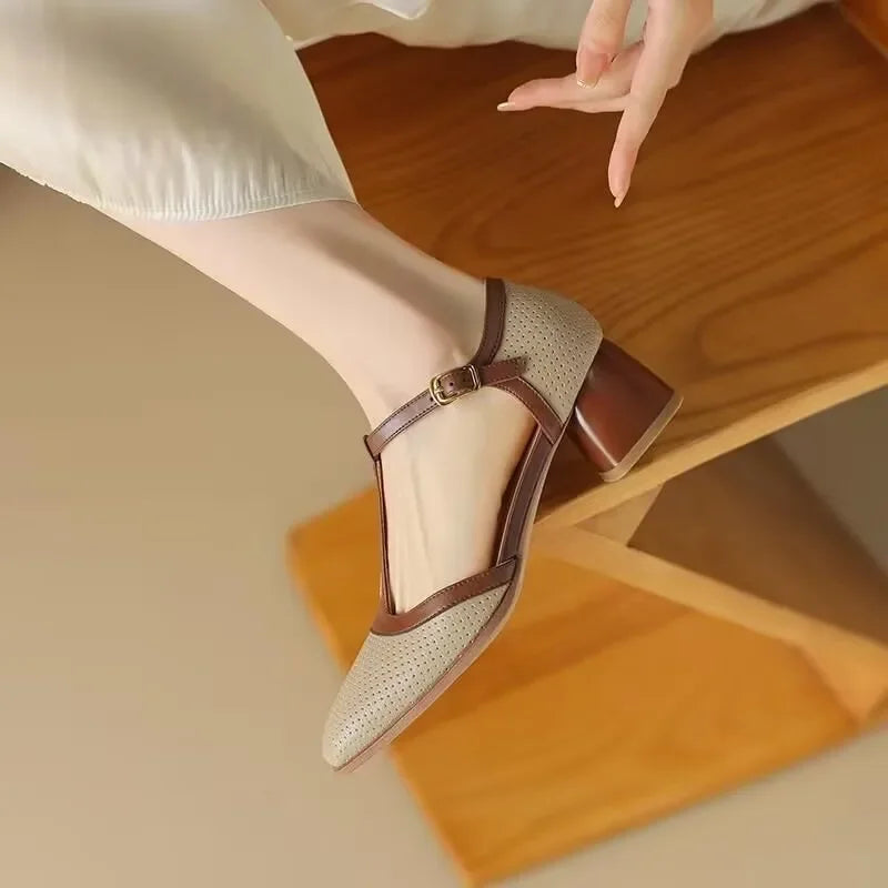 Off-white Isava mid heel leather shoes by THE WHITMORE FAMILY, featuring a stylish design and comfortable mid heel profile.