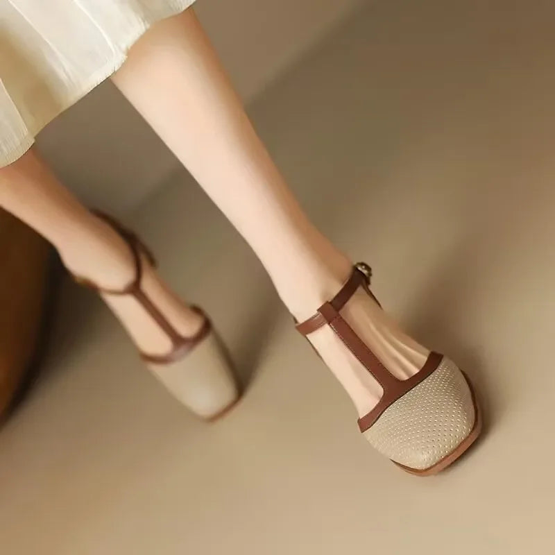 Off-white Isava mid-heel leather shoes by THE WHITMORE FAMILY, featuring a stylish mid heel and sleek leather design.