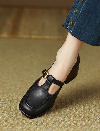 Black Ysolenne T-strap pumps by THE WHITMORE FAMILY, stylish classic footwear with sleek design and comfortable fit.
