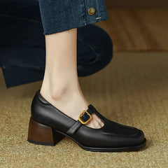 Black Ysolenne T-Strap Pumps by THE WHITMORE FAMILY, stylish classic footwear with sleek design and comfortable fit.