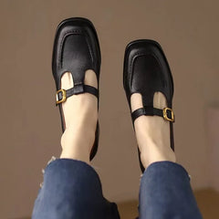 Black Ysolenne Classic Stylish T-Strap Pumps by THE WHITMORE FAMILY, elegant footwear with a T-strap design for women.